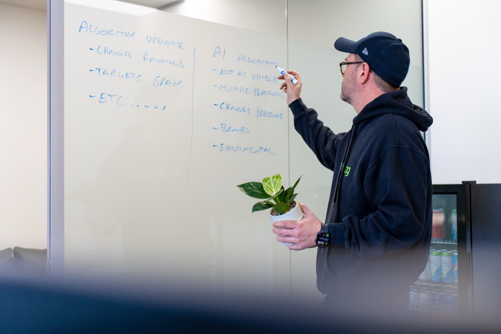 Nick Brogden mapping AI search algorithm changes on a whiteboard